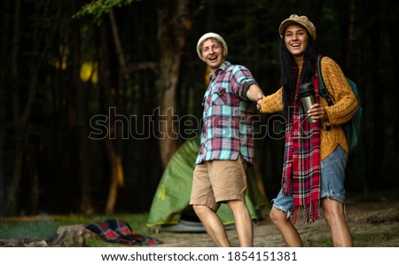  Couple in love. Camping fire. Love story. Romance lovers. Fashion photo.