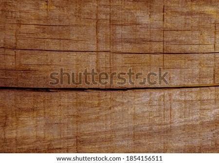 Broken wooden planks.  brown surface of old wood planks cracked, aging process, weathered and worn