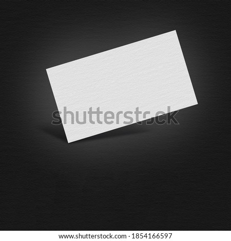Business card mockups on the dark background. 
