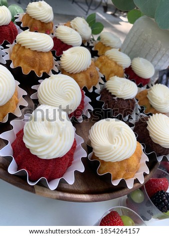 Small bunt cakes with icing ready to be served at wedding