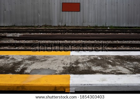 railway with footpath with red sign
