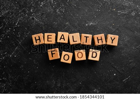 The inscription "Healthy food" is laid out from cubes. Top view.