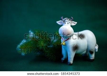 symbol of 2021, year of the bull, cow on a green background close-up