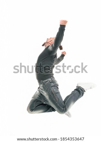 rapper guy is dancing breakdance . photo in jump