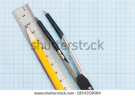 Geometry set with compass,pencil,ruler on graph paper