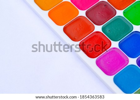 bright watercolor paints on a white background. Watercolor on a white background. Background with watercolors and place for text