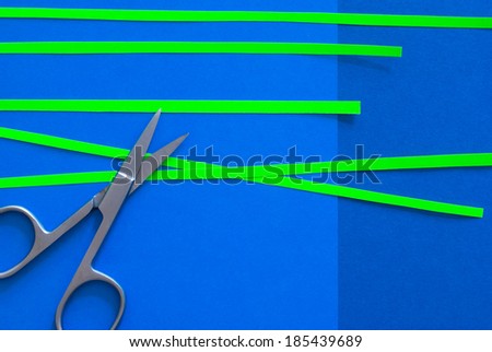 scissors on blue background and green stripes - creative desktop design - text space
natural greenery - trend color 2017