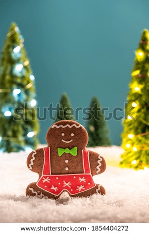 Small Kids Play in Snow At Christmas Time. Gingerbread Funny Family. Festive Greeting Card.