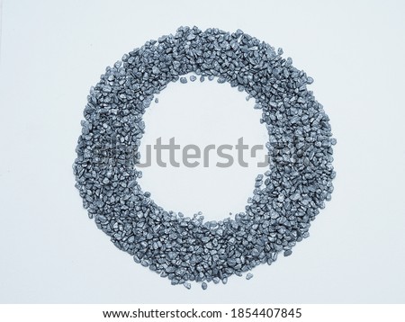 background of silver nuggets that creates a creative frame