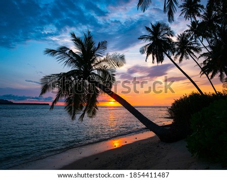 Sunset dramatic sky on sea, tropical desert beach, no people, stormy clouds, travel destination, Indonesia Banyak Islands Sumatra