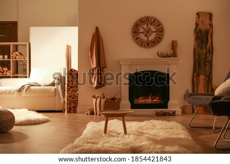 Beautiful view of cozy living room interior with fireplace