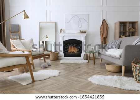 Beautiful living room interior with fireplace and armchairs