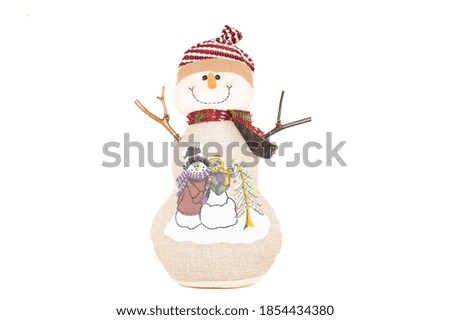 Christmas toy snowman, isolated, with a scarf and hat