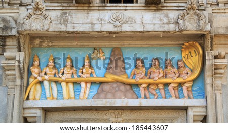 Lord Shiva Temple in Murudeshwar, Karnataka, India. Gods and demons pull a sacred snake Anand.