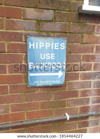 Rusty blue sign for hippies 