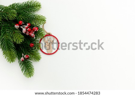 Spruce branch, cones and vintage toys decoration on christmas or new year on white background 
