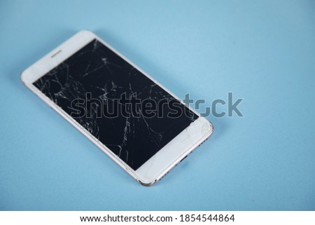 broken phone  on the table background