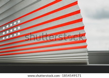 Fragment of paper blinds for a white plastic window with an image of the American flag