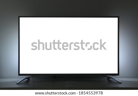 Close-up large white screen for text or video.TV in a cozy living room.