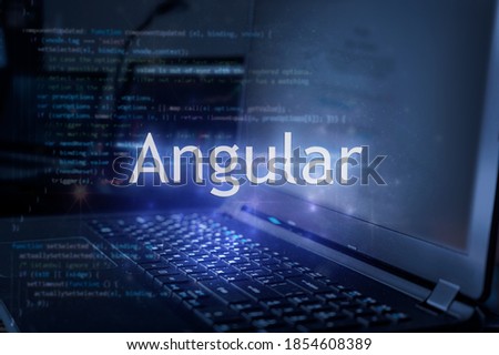 Angular inscription against laptop and code background.  Learning angular programming language. Royalty-Free Stock Photo #1854608389