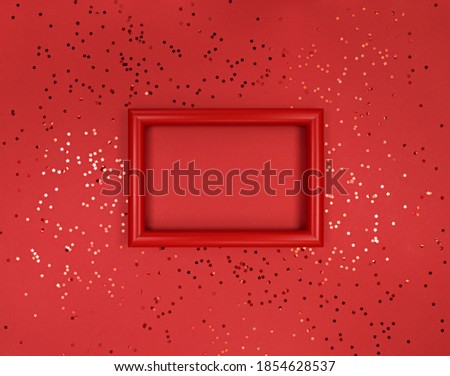 Frame and confetti stars on a red background.