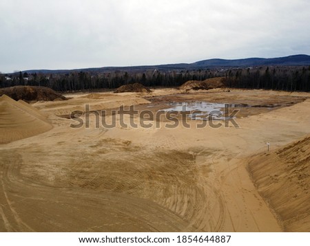 a bird's-eye view of an open-air sand pit