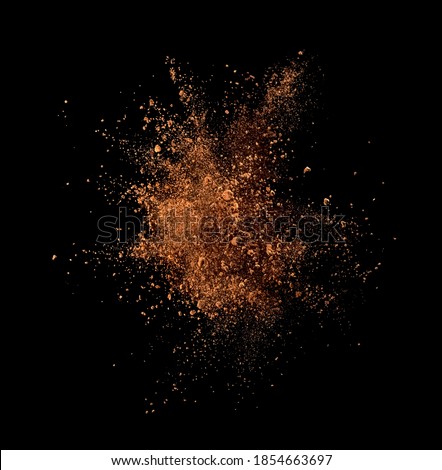 Cocoa powder explosion on black background Royalty-Free Stock Photo #1854663697