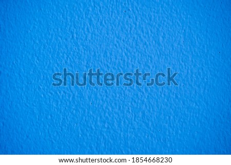 close up shot on surface of rough navy blue concrete wall for background.