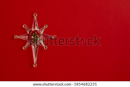 Christmas decoration star on red background
