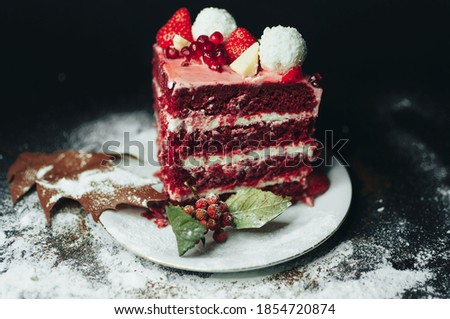 pease of organic strawberry cake on black background with powder