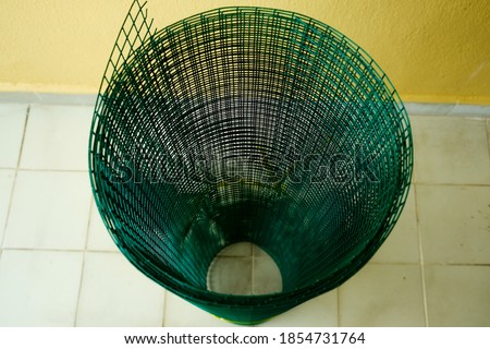 A top down picture of pvc coated wire mesh in coil use to make fence and avoid animal enter the house.