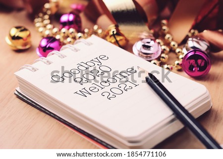 Goodbye 2020 welcome 2021 with decoration. We wish you a new year filled with wonder, peace, and meaning. Royalty-Free Stock Photo #1854771106