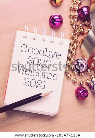 Goodbye 2020 welcome 2021 with decoration. We wish you a new year filled with wonder, peace, and meaning. Royalty-Free Stock Photo #1854771154