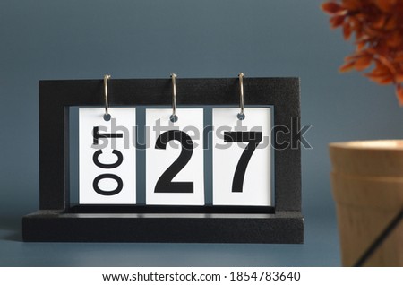 October 27, Date design with a black wooden calendar for a business, Date Plans to remind.