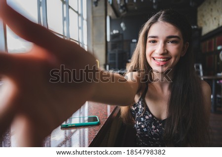 young cute women taking selfie
