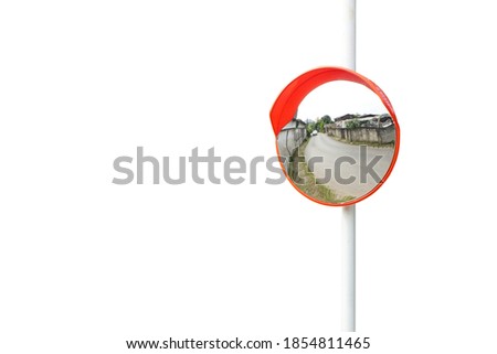 The traffic curve mirror, convex mirror on the road for safety isolated on white background with clipping path. The virtual image is upright, smaller than the object. Royalty-Free Stock Photo #1854811465