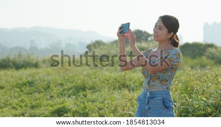 Woman use of cellphone to take photo