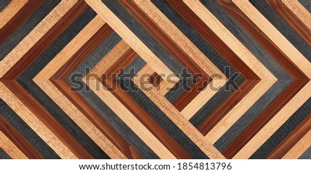 Dark brown parquet floor with chevron pattern. Wood texture background. Vintage wooden wall made of narrow planks.