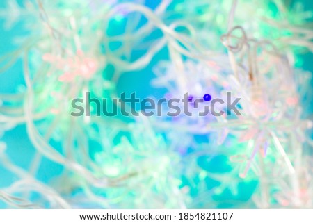 Abstract background with a garland of snowflakes. Christmas mood. copy space, top view, flat lay, background with blank space for text