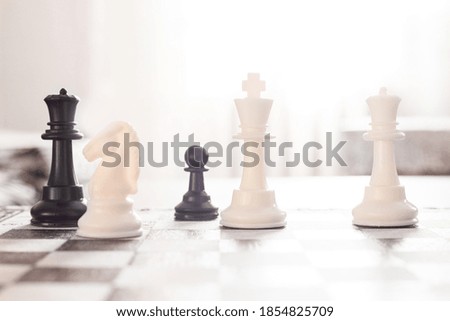 Closeup chess figures on a blurred background