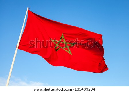 National flag of Morocco above blue sky Royalty-Free Stock Photo #185483234