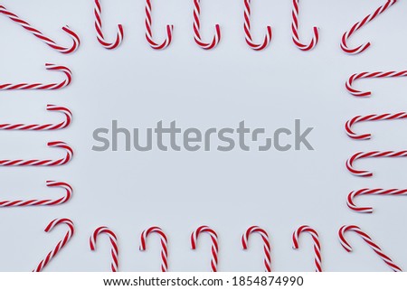 Pattern of christmas candy canes on a white background