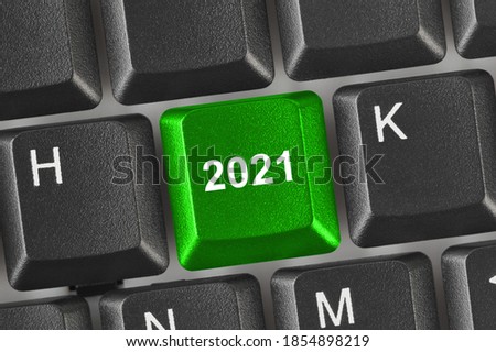 Computer keyboard with 2021 key - holiday concept