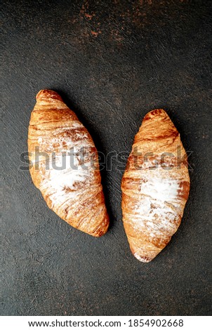 two croissants on a stone background