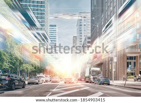 metaverse,5G concept, Meta, types of data flows through the streets, Cars are parked among the tall buildings in this business area, people working, learning, at home, video calls, online shopping Royalty-Free Stock Photo #1854903415