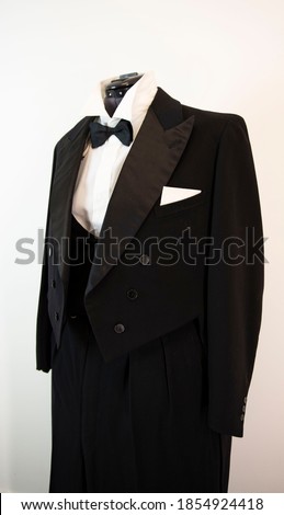Vitazhny tailcoat, with a vest shirt and a black bow tie. Royalty-Free Stock Photo #1854924418
