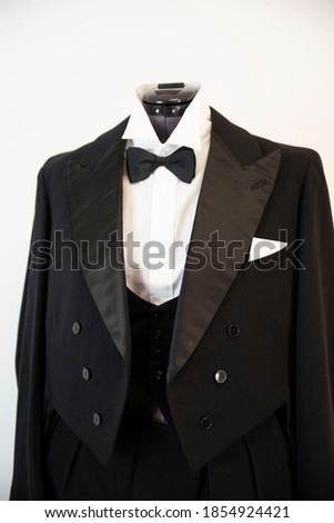 Vitazhny tailcoat, with a vest shirt and a black bow tie. Royalty-Free Stock Photo #1854924421