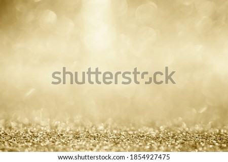 Abstract gold glitter sparkle blurred with bokeh background