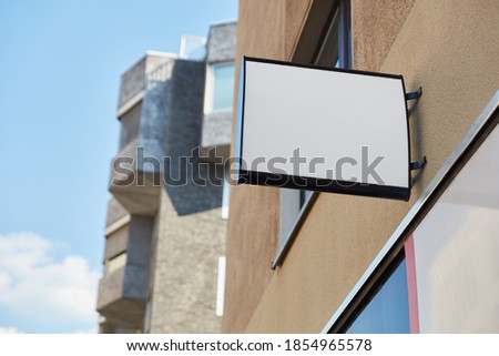 White Business Sign Mock-Up Template on City Buildings