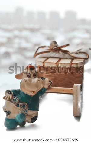 Christmas decoration, 2021 money bull symbol on a window with a sleigh